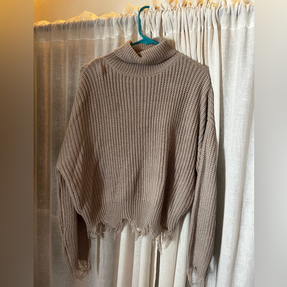 Beige knit distressed turtle neck sweater